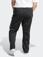 adidas Originals - FIREBIRD TP - sports pants - black - 3