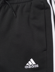 adidas Sportswear - ESSENTIALS FLEECE TAPERED CUFF 3-STRIPES PANTS - pants - black/white - 4