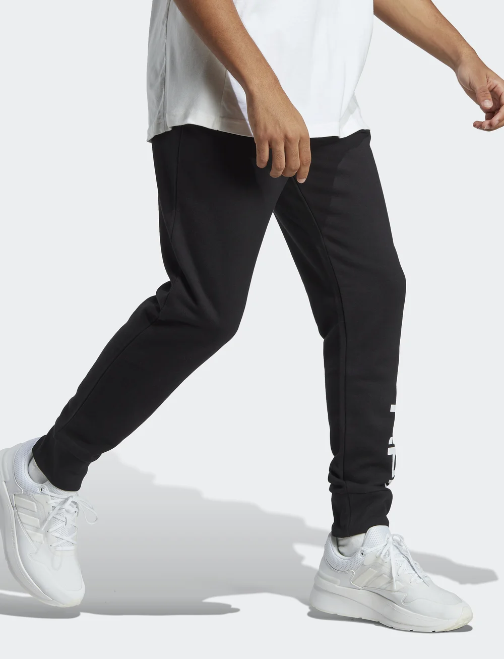 adidas Sportswear - ESSENTIALS FRENCH TERRY TAPERED ELASTICATED CUFF LOGO PANTS - trainingsbroek - black - 4