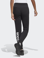 adidas Sportswear - ESSENTIALS LINEAR FRENCH TERRY CUFFED PANT - byxor - black/white - 3