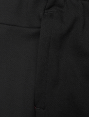 adidas Sportswear - ESSENTIALS LINEAR FRENCH TERRY CUFFED PANT - byxor - black/white - 4