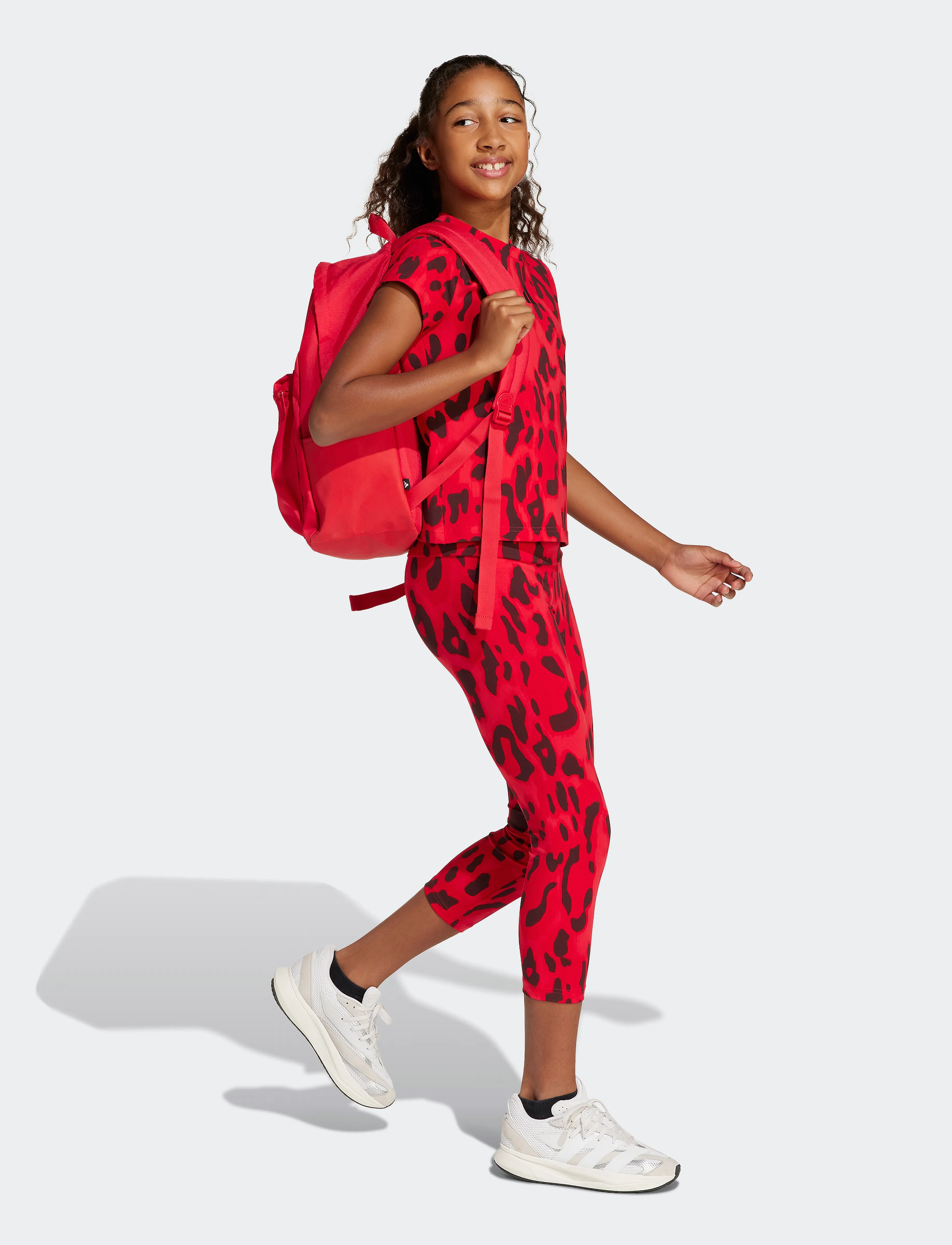 adidas Sportswear JG FI AOP 7/8LE - Leggings - PURRUB/BETSCA/AURRUB/ / red