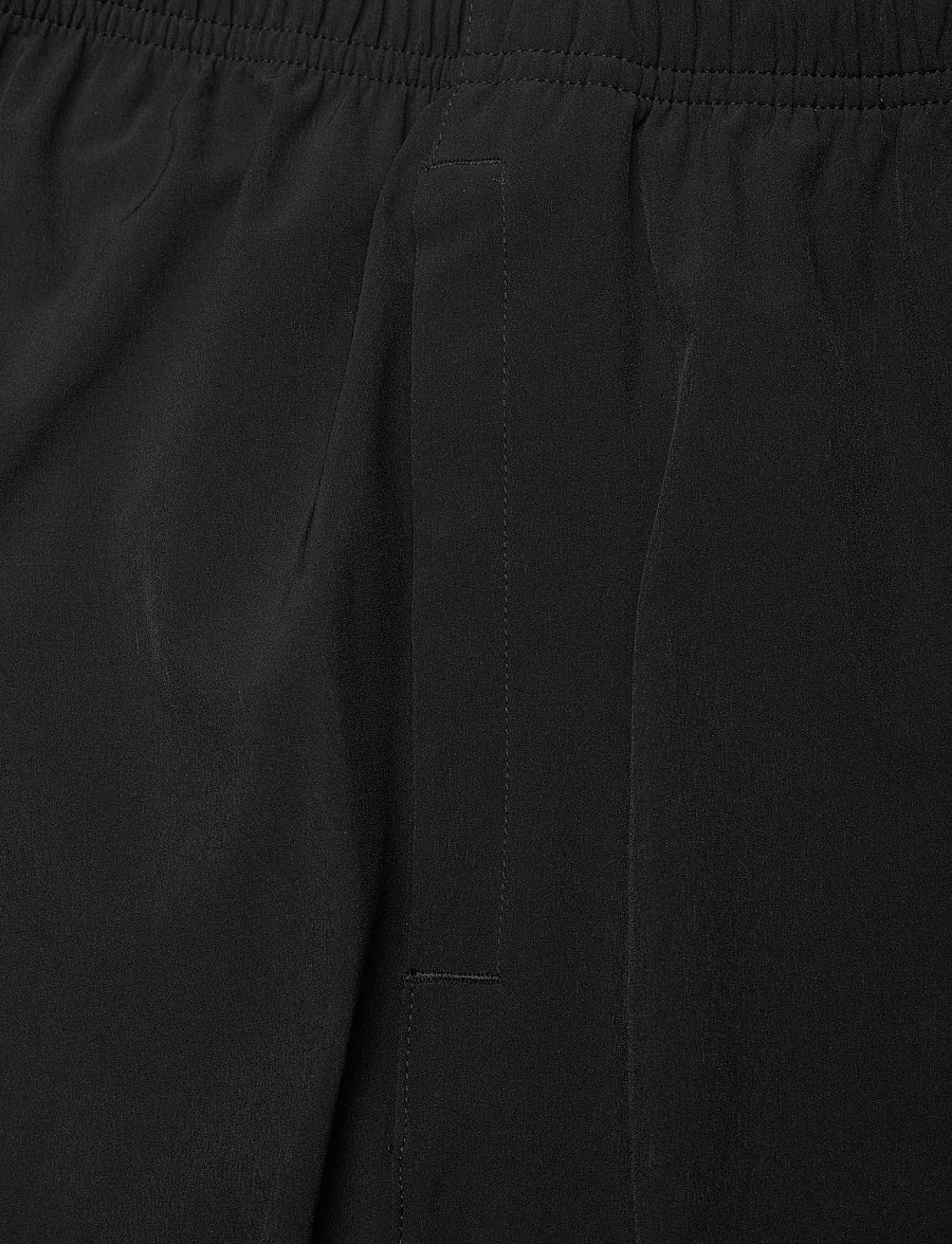Asics - ASICS CORE WOVEN PANT - pantalons - performance black - 4