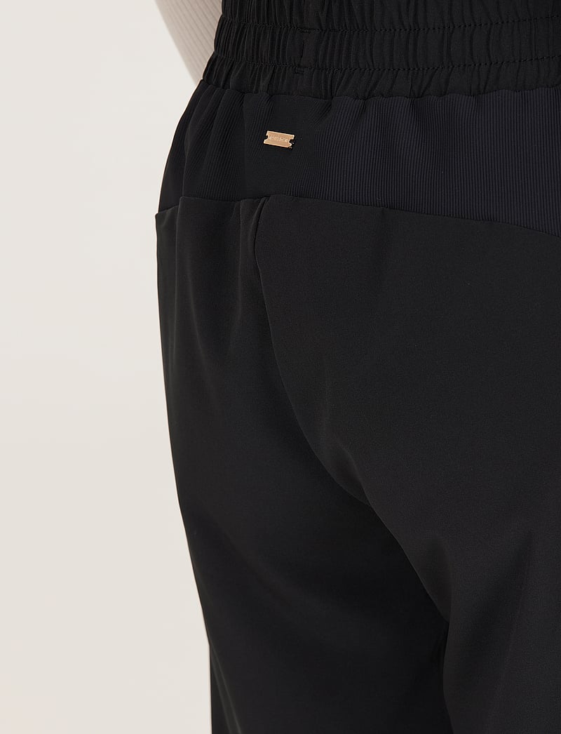 Athlecia - Timmie W Pants - träningsbyxor - black - 5