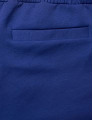 BOSS - Headlo 1 - training shorts - bright blue - 9