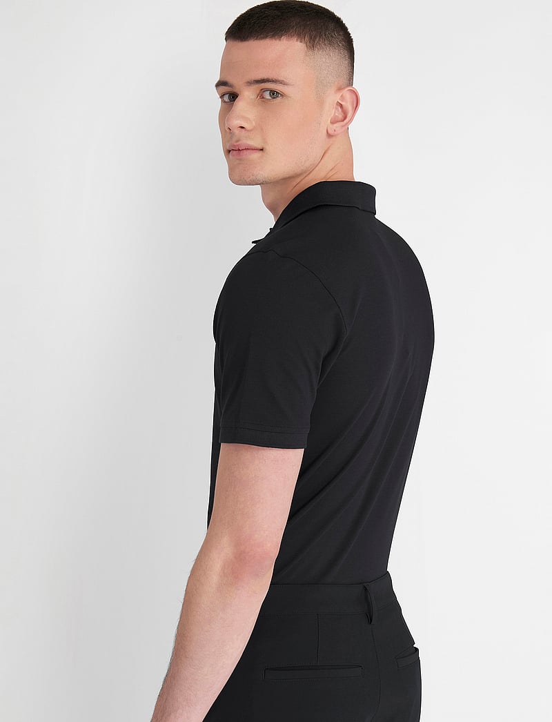 Calvin Klein Golf - PLANET POLO - toppar & t-shirts - black - 5