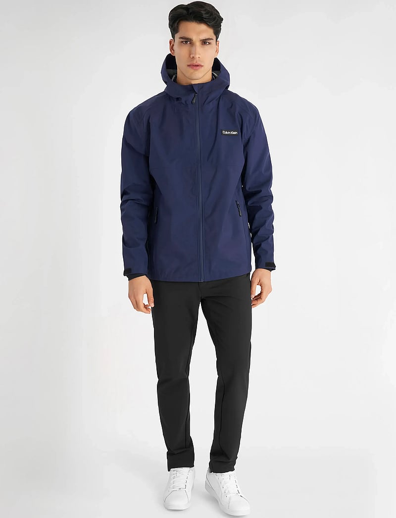 Calvin Klein Golf - FEATHER DRY 15K HOODED WATERPROOF JACKET - golfijakid - navy - 4