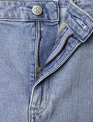 Calvin Klein Jeans - BUCKLE WRAP A-LINE DENIM SKIRT - ballīšu apģērbs par outlet cenām - denim light - 2