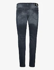 Calvin Klein Jeans - SLIM TAPER - kitsad teksad - denim dark - 1