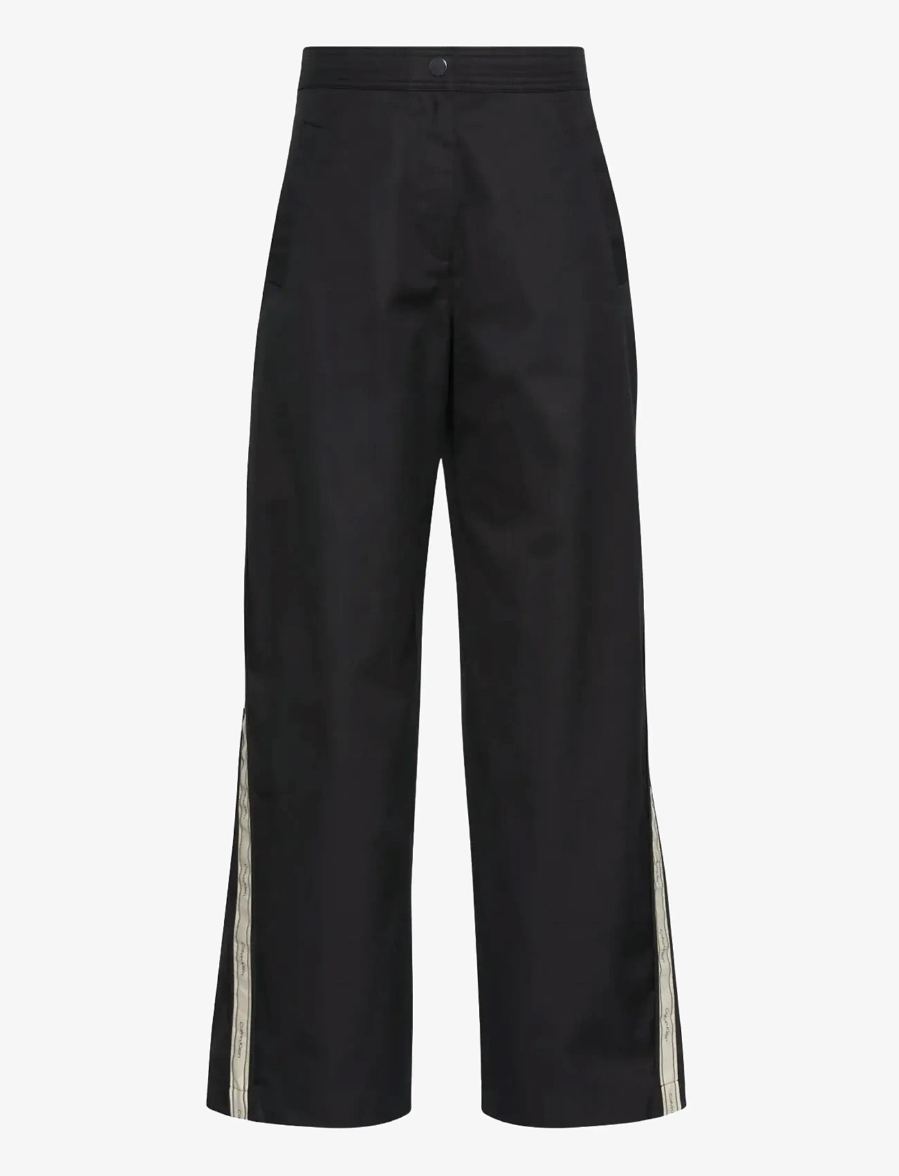 Calvin Klein Jeans - COTTON TWILL AOP LOGO STRIPE PAN - wide leg trousers - black - 1