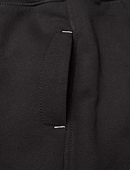 Calvin Klein - INTARSIA LOGO TERRY JOGGER - dressipüksid - ck black - 3