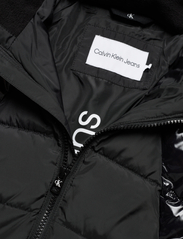 Calvin Klein - MIXED MEDIA BELTED PUFFER COAT - puhvis ja polsterdatud - ck black - 4