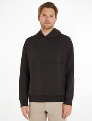 Calvin Klein - COMFORT DEBOSSED LOGO HOODIE - sweatshirts - ck black - 1