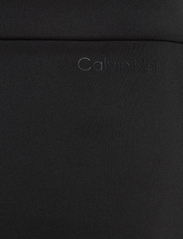 Calvin Klein - TECHNICAL KNIT WIDE LEG - wide leg trousers - ck black - 8