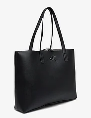 Calvin Klein - MINIMAL MONOGRAM SLIM TOTE34 - tote bags - black - 2