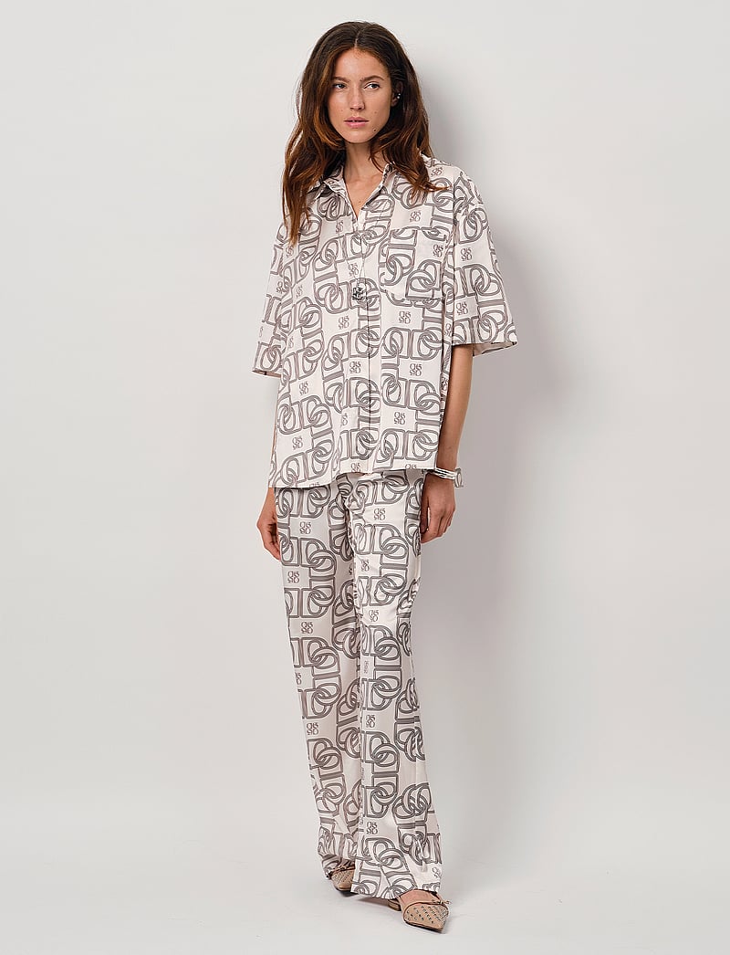 Dante6 - Dante6-Teo logo printed wide leg pants - hosen mit weitem bein - butter cream - 0