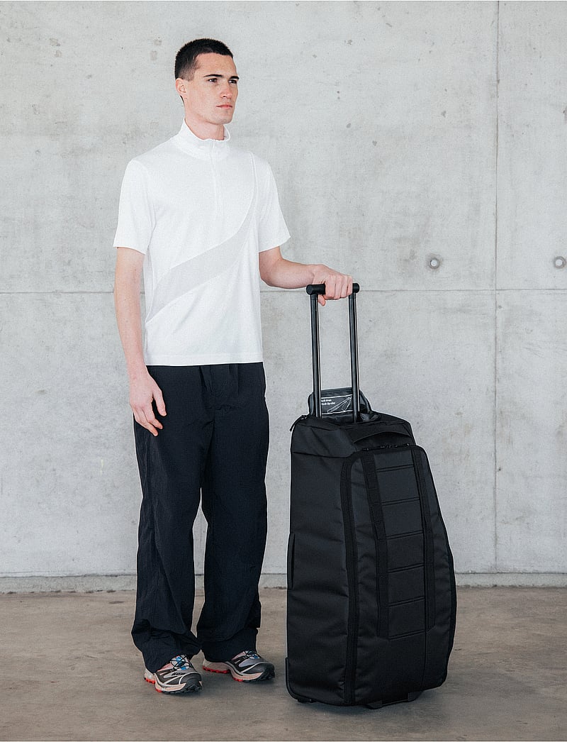 Db Journey - Hugger Roller Bag 60L - torby podróżne - black out - 0