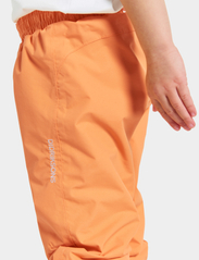 Didriksons - IDUR KIDS PANTS 4 - shell & rain pants - papaya orange - 7