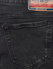 Diesel - 1969 D-EBBEY L.32 TROUSERS - nuo kelių platėjantys džinsai - black/denim - 4