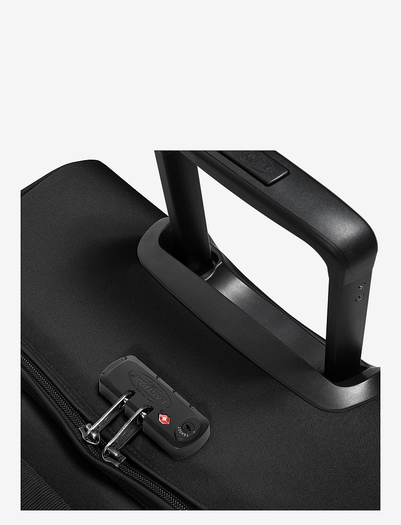 Eastpak - TRANVERZ M - medium resväskor - black - 2