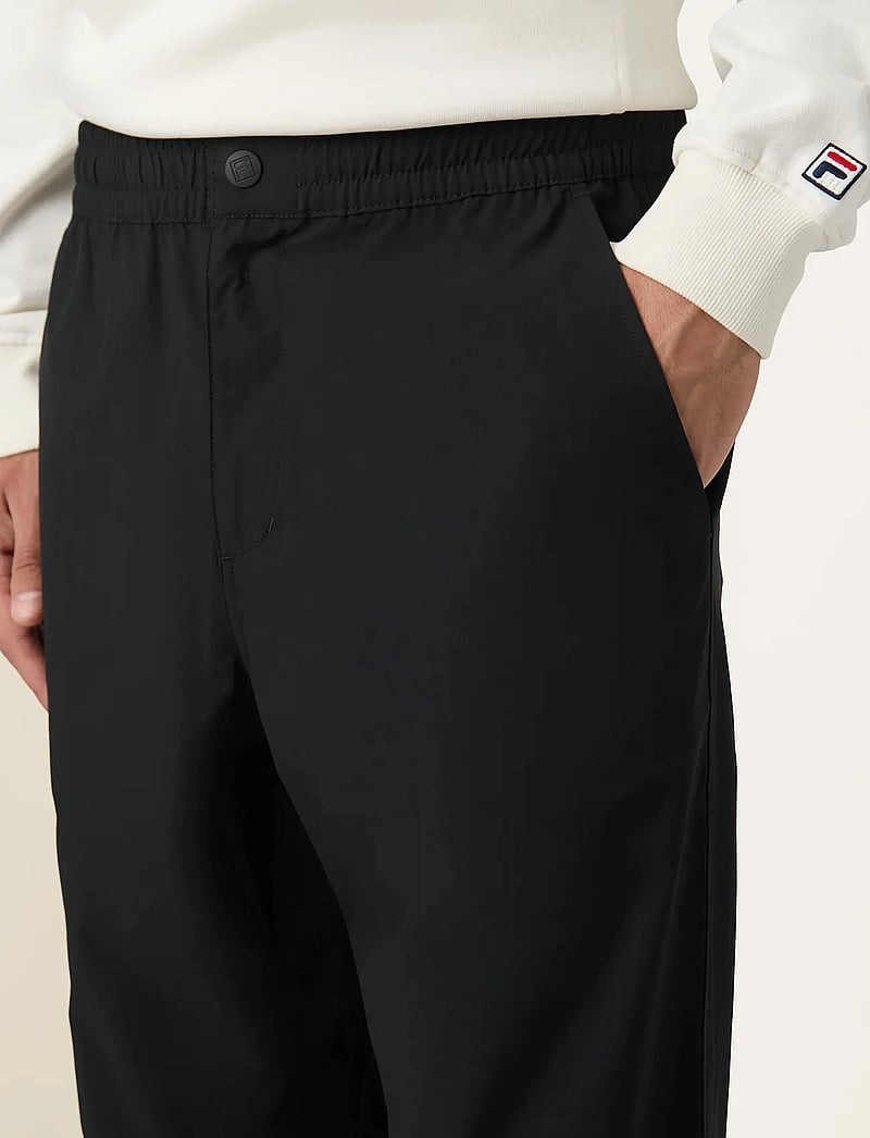 FILA - HIGH TIDE relaxed 4-way stretch trousers - casual byxor - black - 5