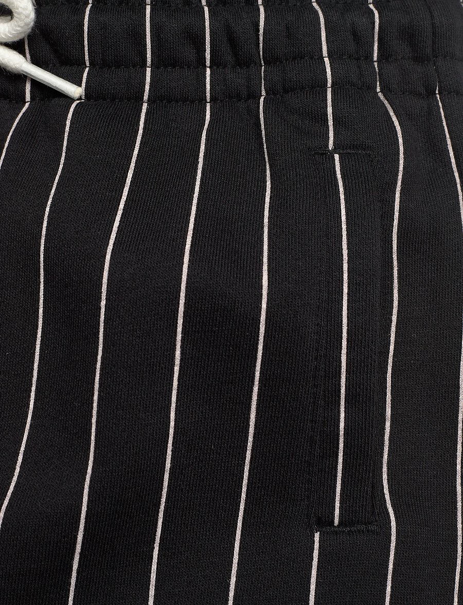 FILA - RIFREDI wide graphic pinstriped sweatpants - sweatpants - black / egret striped (2/1) - 2