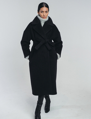 hálo - KAAMOS long coat - pitkät talvitakit - black - 2