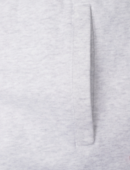 HAN Kjøbenhavn - Sweatpants - sporta bikses - light grey melange logo - 2