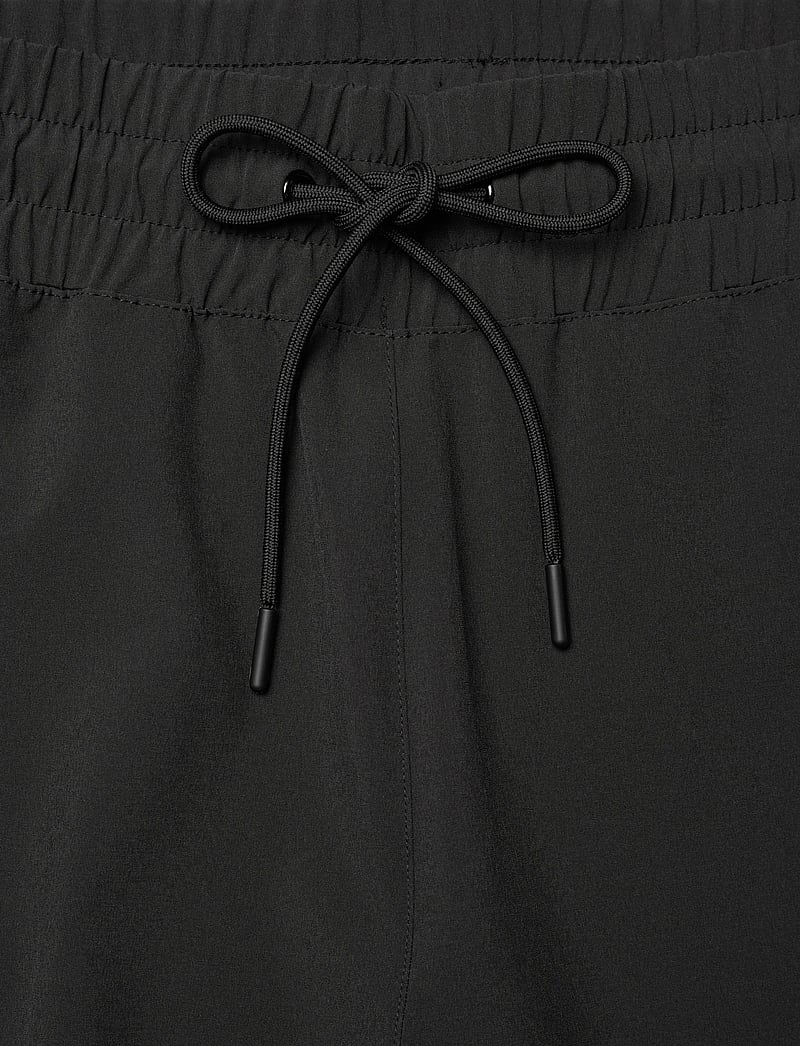 Helly Hansen - W THALIA WIDE PANT - vabaajapüksid - black - 5