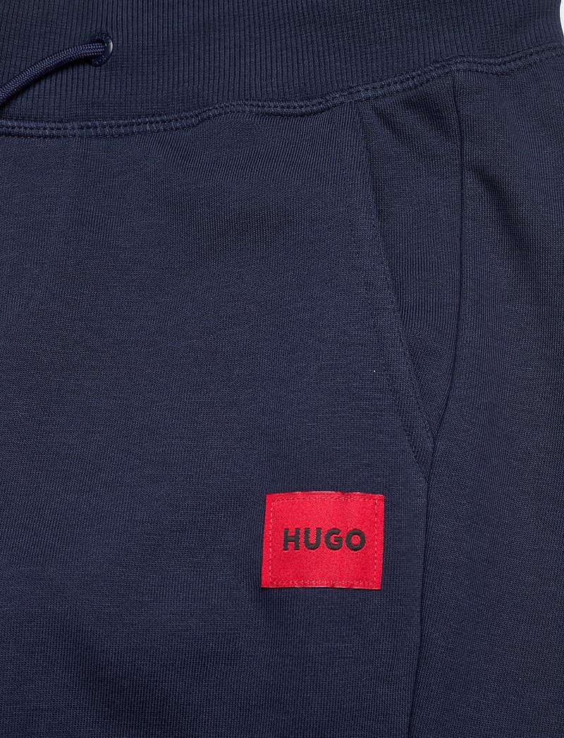 Hugo Kids - JOGGING BOTTOMS - mjukisbyxor - navy - 2