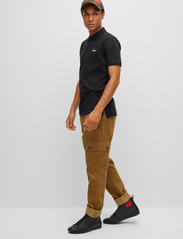 HUGO - Dinos223 - short-sleeved polos - black - 2