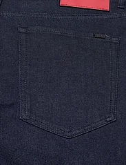 HUGO - HUGO 634 - tapered jeans - dark blue - 4