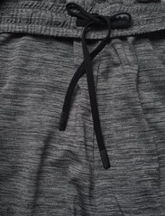 Hummel - hmlASTON TAPERED PANTS - spodnie sportowe - dark grey melange - 6