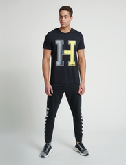 Hummel - hmlRAY 2.0 TAPERED PANTS - lowest prices - black - 3