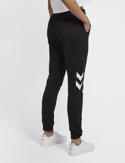 Hummel - hmlLEGACY WOMAN TAPERED PANTS - lowest prices - black - 6