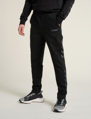 Hummel - hmlLEGACY TAPERED PANTS - lowest prices - black - 4