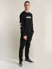 Hummel - hmlLEGACY TAPERED PANTS - lowest prices - black - 5