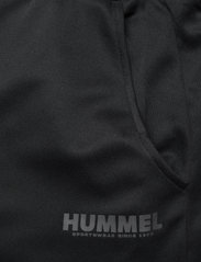 Hummel - hmlLEGACY POLY TAPERED PANTS - najniższe ceny - black - 4