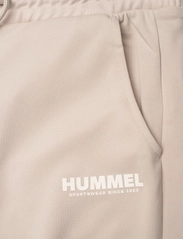 Hummel - hmlLEGACY POLY WOMAN REGULAR PANTS - die niedrigsten preise - pumice stone - 2