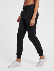 Hummel - hmlNONI 2.0 REGULAR PANTS - die niedrigsten preise - black - 2