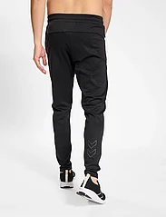 Hummel - hmlMT INTERVAL TAPERED PANTS - spodnie sportowe - black - 6