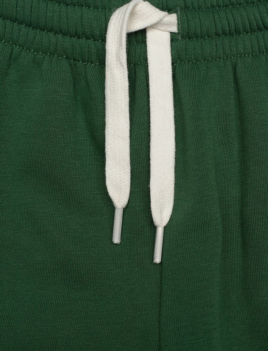 Hummel - hmlMINI LOOSE PANTS BEE - jogginghosen - dark green - 2