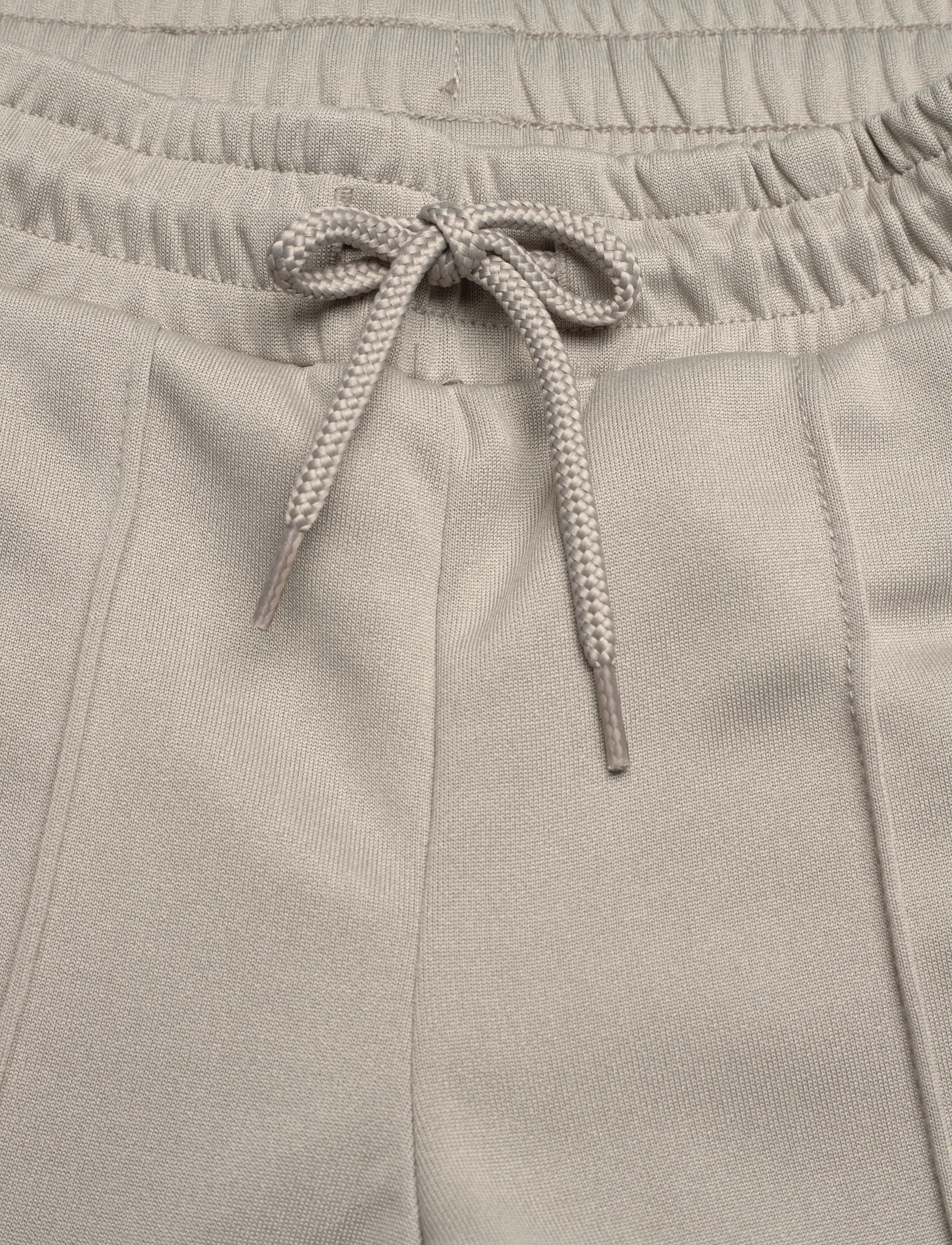 Hummel - hmlJR WIDE LEG POLY TAPE PANTS - sweatpants - rock ridge - 5