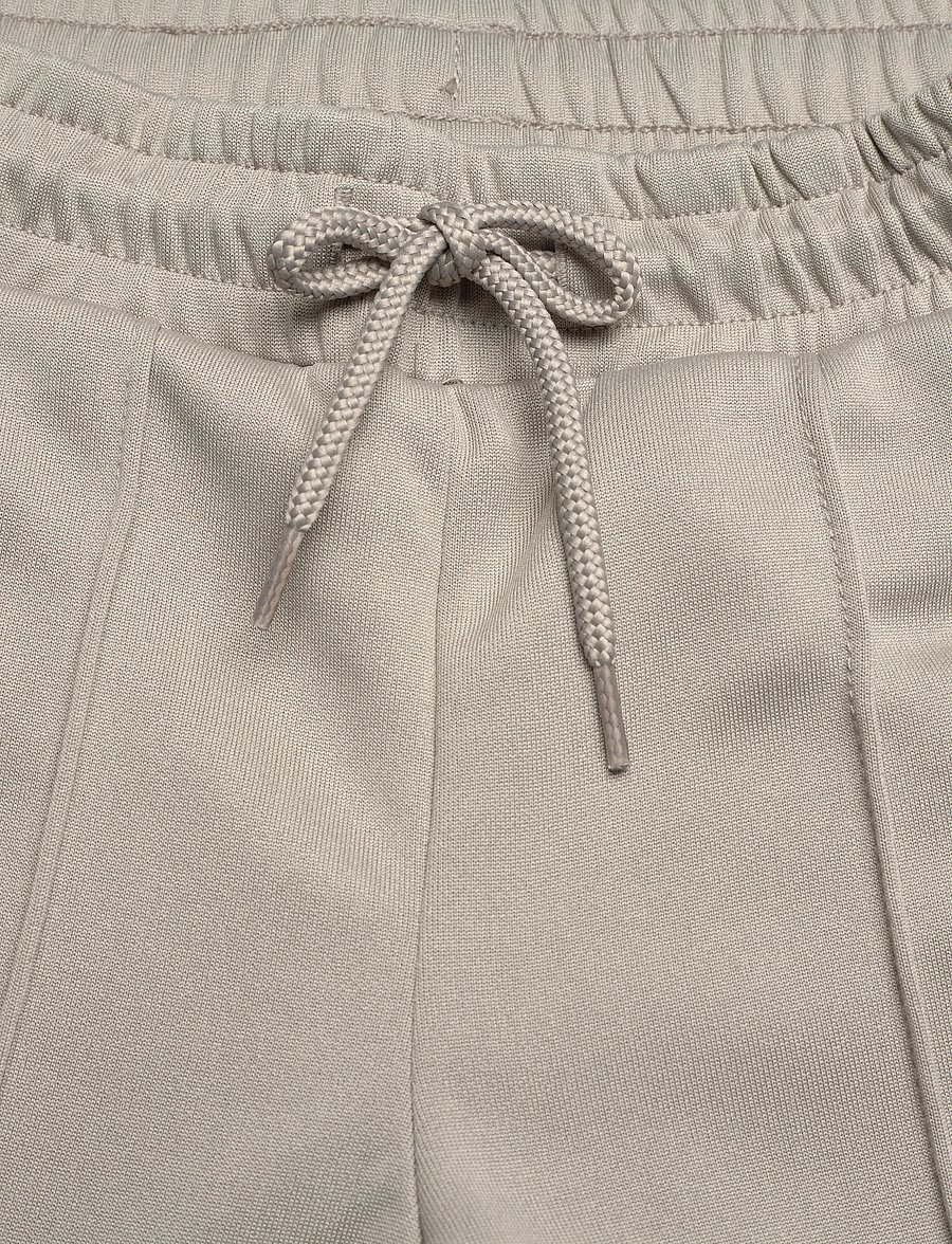 Hummel - hmlJR WIDE LEG POLY TAPE PANTS - jogginghosen - rock ridge - 5