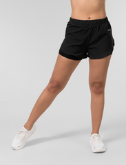 Johaug - Discipline Shorts 2.0 - urheilushortsit - black - 2