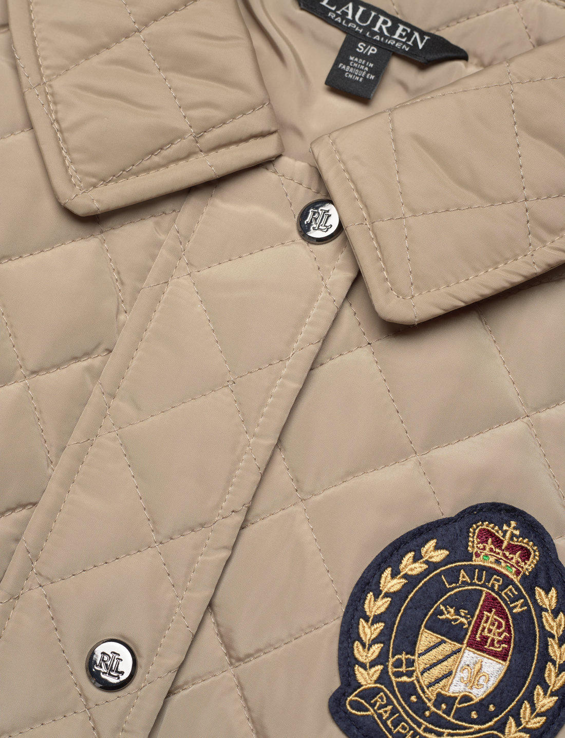 Embroidered crest deals diamond quilted jacket