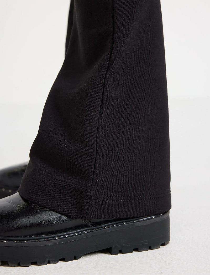 Lindex - Flared leggings with brushed inside - leginsy - black - 4