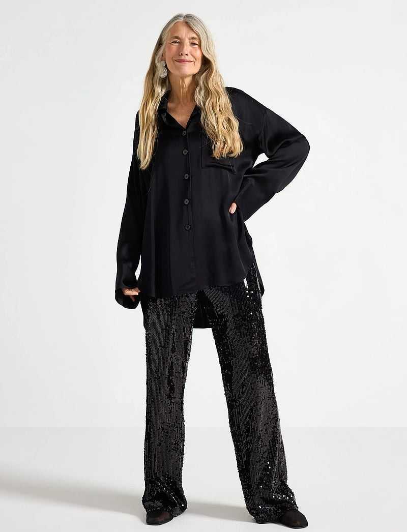 Lindex - Trouser sequin - straight leg hosen - black - 0