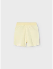 name it - NKFDEBBIE VEL SHORTS - sweat shorts - pastel yellow - 1