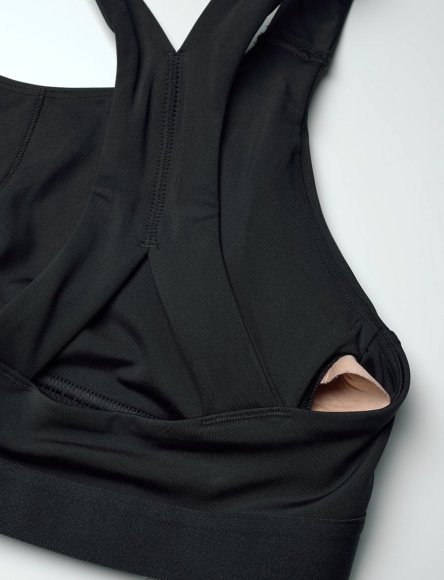 New Balance - NB Essential Train Bra - medium støtte - black - 2